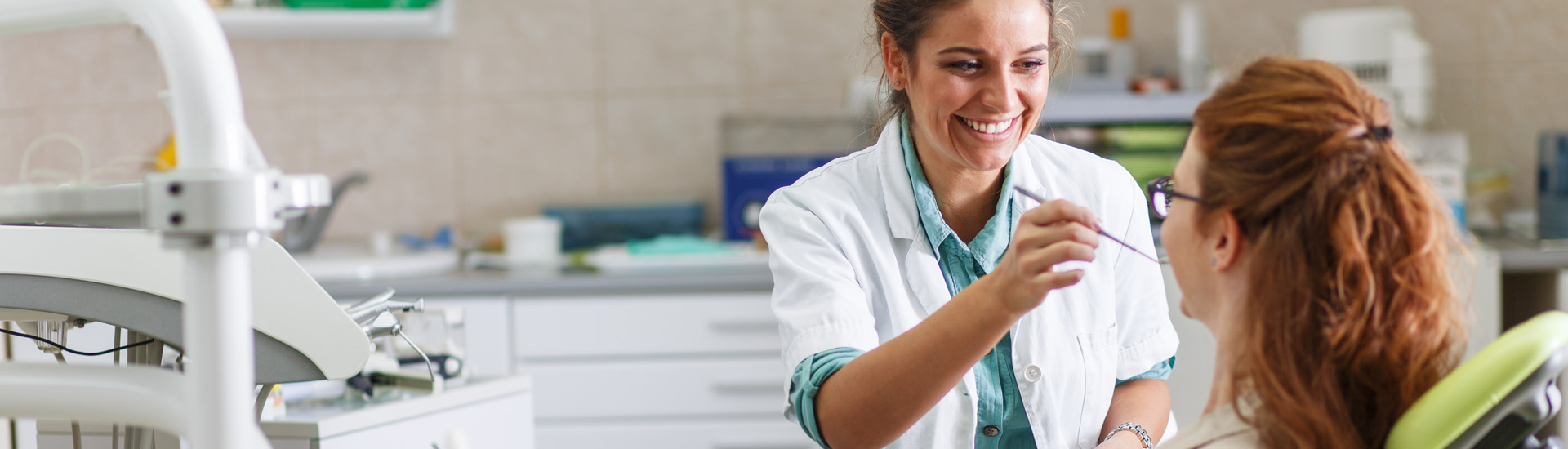 Female Dentist Check Up a Female Patient